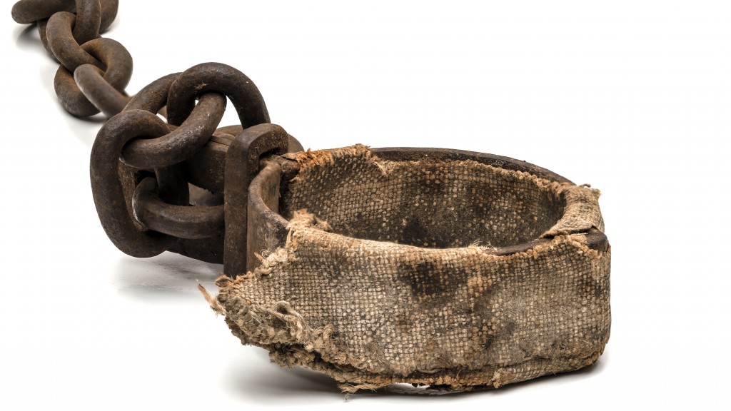 Rusty padded shackles used for locking up prisoners or slaves between 1600 and 1800. This might be a leg cuff or a neck cuff